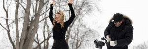 Image of woman in blacnk being filmed in a winter tree scape. Bailaora 1920 x 640
